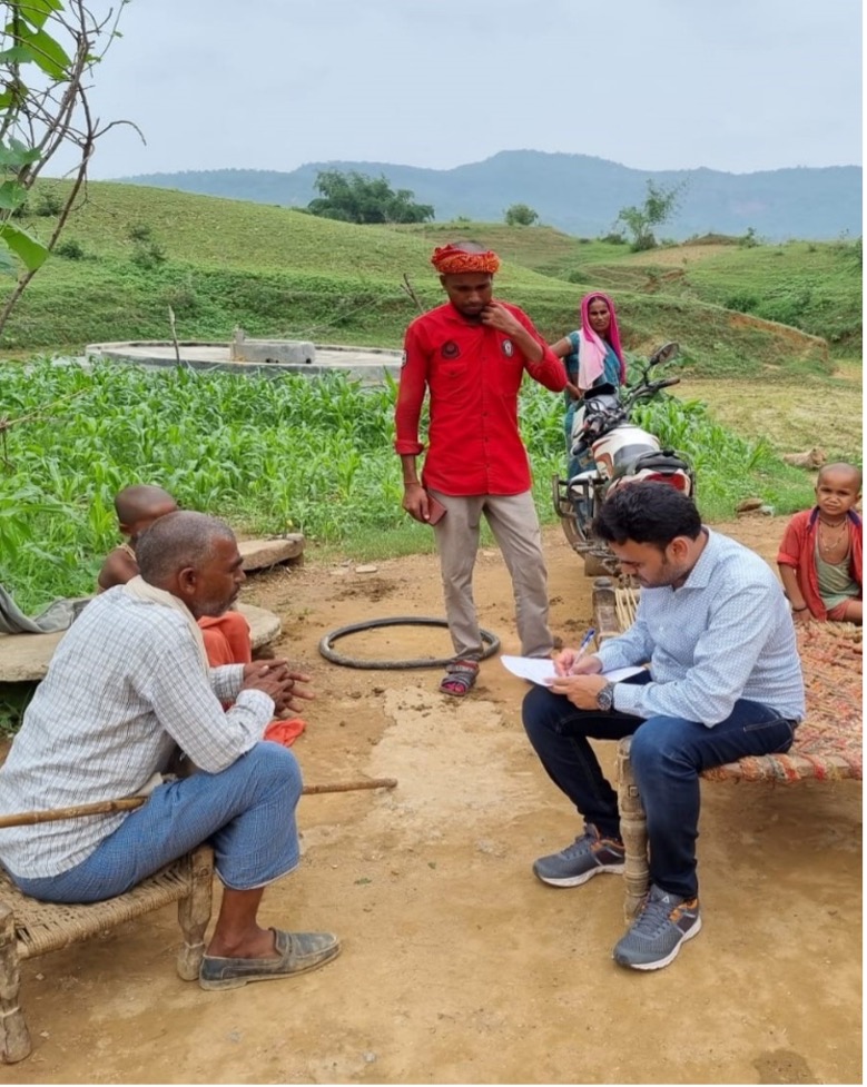 EIS officer interacting with a community member during a diarrheal disease outbreak investigation, Sonbhadra district, Uttar Pradesh, August 2023